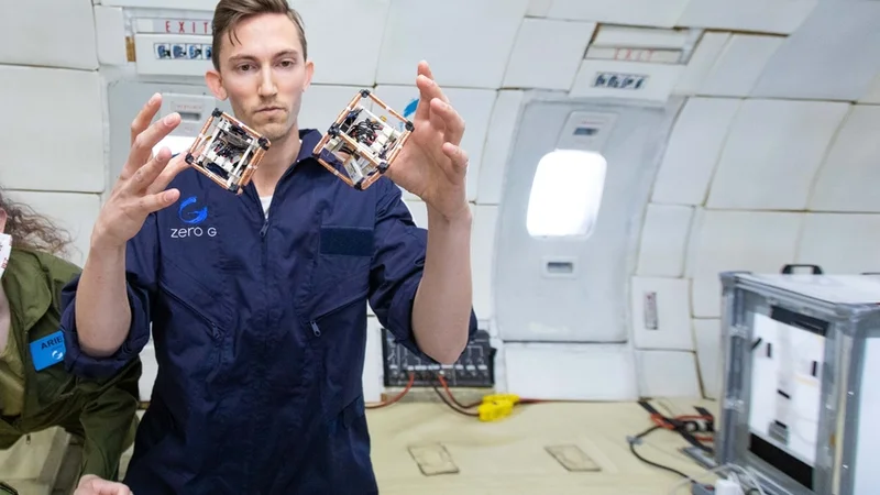 MIT PhD student Martin Nisser tests self-reconfiguring robot blocks, or ElectroVoxels, in microgravity. Photo: Steve Boxall/ZeroG