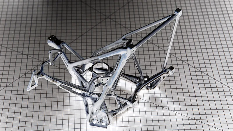 Defined by a human designer, and filled in by an artificial intelligence program, this scaffold was milled from a solid block of aluminum and features connections for mirrors and instruments as well as pathways preserved for laser light and human hands to attach and adjust sensors. Credit: Henry Dennis