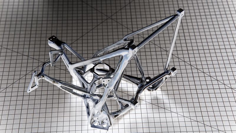 Defined by a human designer, and filled in by an artificial intelligence program, this scaffold was milled from a solid block of aluminum and features connections for mirrors and instruments as well as pathways preserved for laser light and human hands to attach and adjust sensors. Credit: Henry Dennis