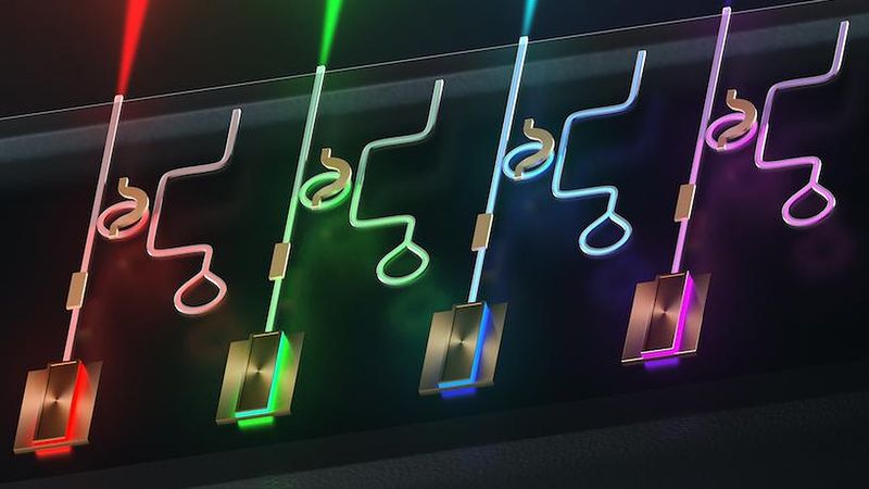 Illustration of the integrated laser platform created by the Lipson Nanophotonics Group, where a single chip generates narrow linewidth and tunable visible light covering all colors. Credit: Myles Marshall/Columbia Engineering
