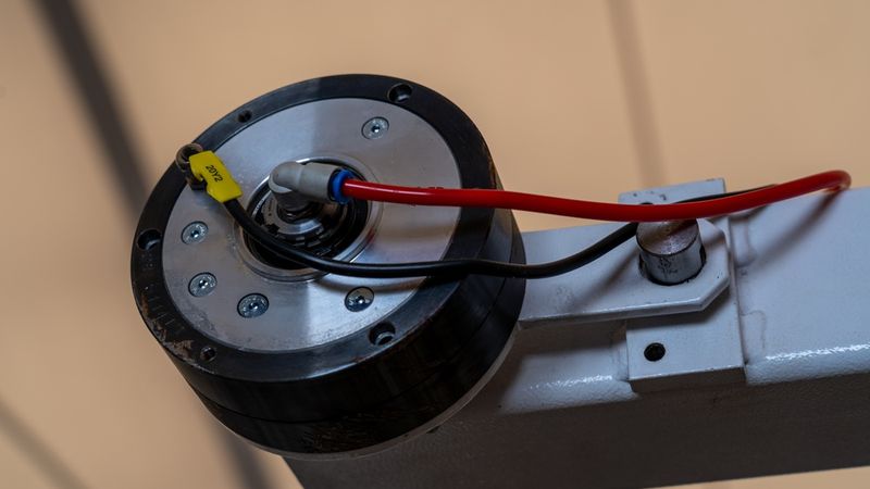 Industrial Rotary Actuator with Pneumatic Hose, Automated Machinery Component