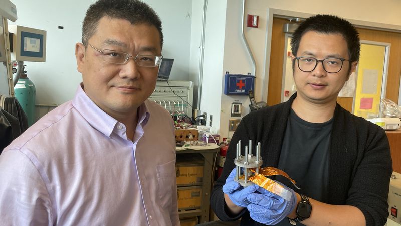 Hailong Chen and Zhantao Liu present a new, low-cost cathode for all-solid-state lithium-ion batteries. Photo by Jerry Grillo