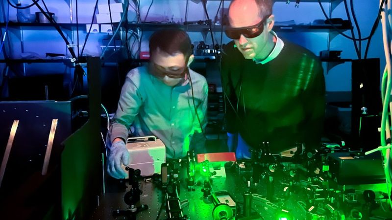 Doctoral student Jialun Luo (left) and Greg Fuchs, Ph.D. ’07, professor of applied and engineering physics in Cornell Engineering, searched for a “spin degree of freedom” in the popular semiconductor gallium nitride and found it, surprisingly, in two distinct species of defect. Credits: Charissa King-O’Brien/Cornell Engineering