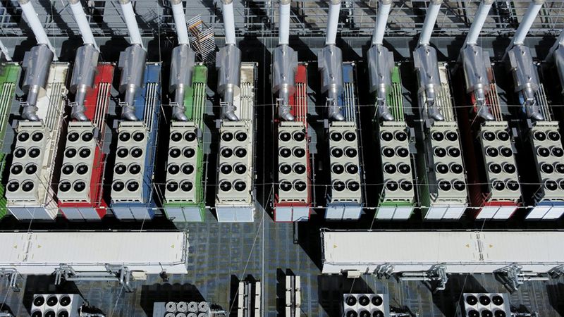 These ‘chillers’ on the roof of a data center in Germany, seen from above, work to cool the equipment inside the building. AP Photo/Michael Probst