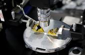 Programmable optical chip merges photons to change color