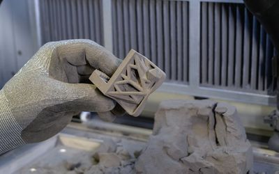 Why are SLS 3D printers suitable for small businesses?