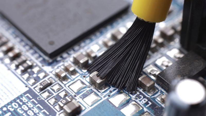 Precision Cleaning Brush on an Electronic Board 