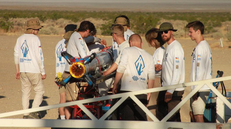 The assembly team preparing the rocket. 