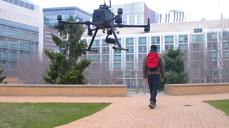 Makram Chahine, a PhD student in electrical engineering and computer science and an MIT CSAIL affiliate, leads a drone used to test liquid neural networks. Photo: Mike Grimmett/MIT CSAIL