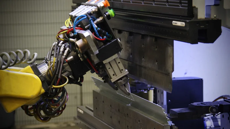 Close-up of the robot with the redesigned gripper in action