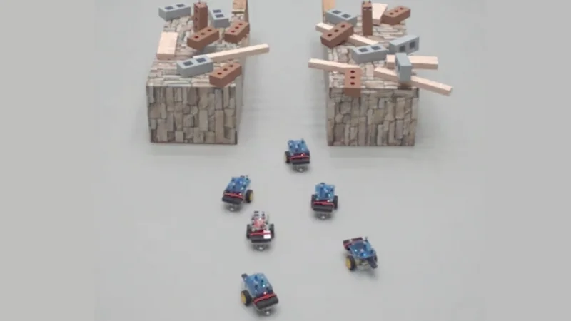 A new control mechanism allows teams of robots (above) to calculate the tradeoffs of maintaining a communication network and move through difficult terrain, including narrow hallways. (Credit: REACT Lab/Harvard SEAS) 