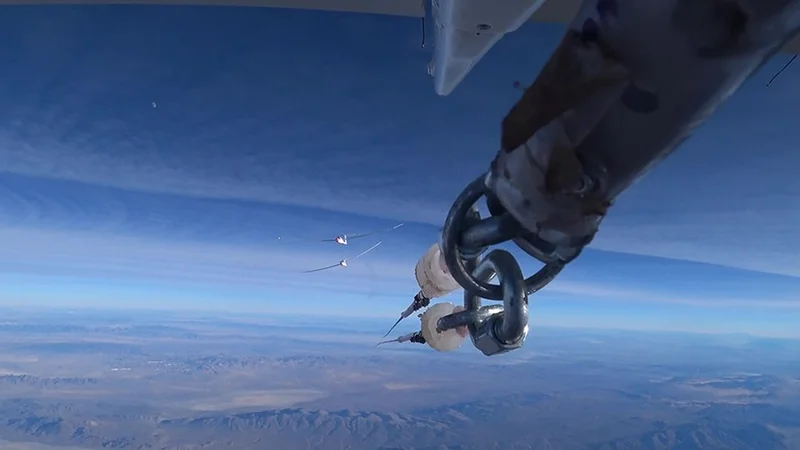 Released at nine kilometres altitude. Image from the tail camera of the Egrett as it released the Blue Condor Arcus glider from its tow. The Blue Condor, with a hydrogen engine and an optically very thin contrail, is at the front. Credit: AV Experts LLC