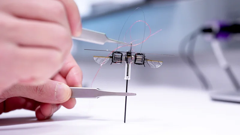 MIT researchers developed a hopping robot that can leap over tall obstacles and jump across slanted or uneven surfaces, while using far less energy than an aerial robot. Credit: Melanie Gonick, MIT